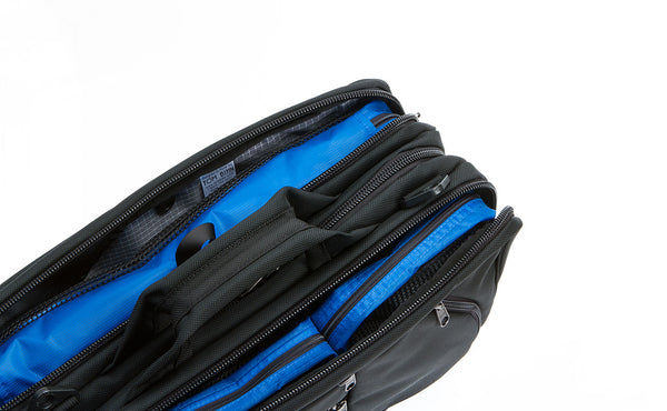 A Black Tri-Star filled with one each of a Small, Medium, and Large Tri-Star Packing Cube.